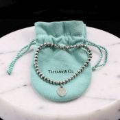 A Tiffany & Co silver 'Return to Tiffany' bracelet with heart-shaped fob, length 17cm,