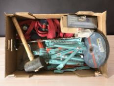 A group of tools including cutting disks, mallet, drill bits, etc.