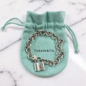A Tiffany & Co silver padlock bracelet, length 17cm, with Tiffany pouch.