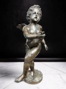 A contemporary hollow cast patinated bronze figure of a winged cherub musician holding a horn,