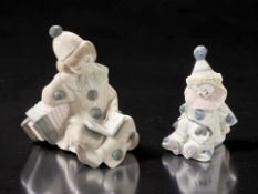 A Lladro figure of a seated harlequin girl with accordion,