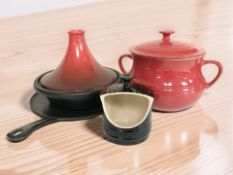 A Le Creuset red glazed ceramic twin handled tureen and cover,