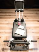 A pilates machine and a pair of ski poles.