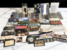 A collection of Royal Mail mint stamp packs containing numerous first and second class stamps,