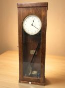 A Gibson Master Clock in oak case