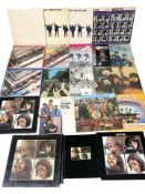 A collection of The Beatles vinyl LP records.