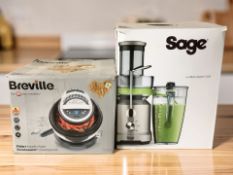 A Breville fryer and a Sage juicer, both in boxes.