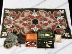 A group of decorative beadwork items including a purse, a cased necessaire, plus another.