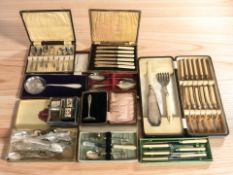 A group of boxed cutlery, napkin rings, etc.