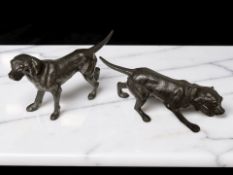 Two hollow cast patinated bronze figures of pointers, length 16 cm.