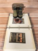 An album of reproduction Cunard colour postcards and a pair of early 20th century lacquered brass