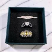 A Charles Horner silver bar brooch and two contemporary gem set silver dress rings.
