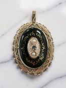 A Victorian black enamel, split pearl and sapphire mourning brooch/pendant, length 47mm.