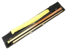 A two piece Riley snooker cue in case.
