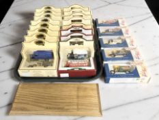 Approximately twenty three boxed die cast delivery vans and buses including Days Gone,