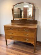 An Edwardian mahogany four drawer mirror back dressing chest, 110 cm x 49 cm x 151 cm.