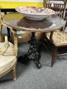 A Britannia-style painted cast iron pub table, height 72 cm.