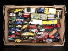 A quantity of unboxed die cast delivery vans, buses and other vehicles including Days Gone, etc.