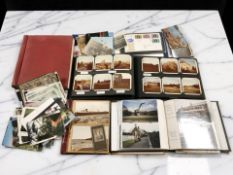 Several albums of stamps and postcards.