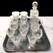 A group of crystal drinking glasses including Stewart and a decanter with stopper.