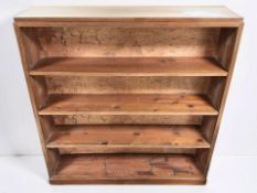 An early 20th century mahogany and pine open bookcase, 117 cm x 23 cm x 123 cm.