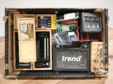 A group of tool sets including router and drill bits.