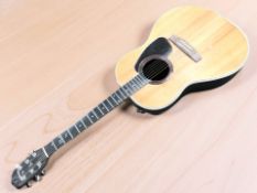 An Applause electro-acoustic guitar.