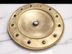 An ecclesiastical gilt brass and polished agate cabochon inset pedestal tazza, diameter 33 cm.
