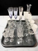 A group of etched and cut crystal drinking glasses.