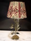 A contemporary brass table lamp with shade, height 87 cm.