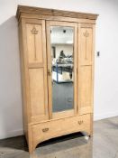 An Edwardian oak mirrored single door wardrobe, 114 cm x 47 cm x 196 cm.