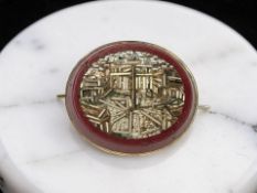 A small micro mosaic brooch in yellow metal backing, width 2cm.