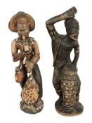Two African carved wooden statues, height 57 cm.
