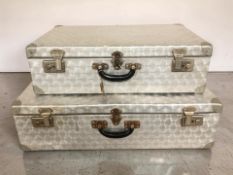 Two graduated aluminium luggage cases with keys, larger 76 cm wide.