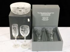 A boxed pair of Waterford Crystal Millennium Collection champagne glasses, height 23.