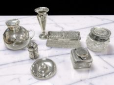 A group of silver-lidded dressing table jars, another with plated lid, a small silver sifter,