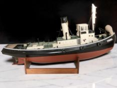 A large remote control scale model of a fishing trawler 'Emma', length 90 cm, on wooden stand.