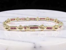 An 18ct yellow gold bracelet channel-set with square-cut rubies, length 18.