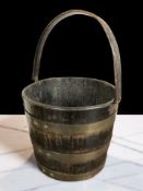 A 19th century oak and brass bound bucket/pail, height 48 cm including swing handle.