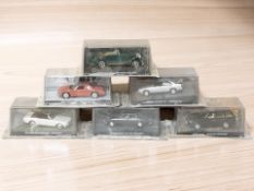 Six die cast James Bond cars.