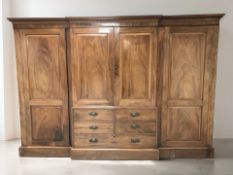 A Regency-style mahogany four door compactum wardrobe, late 19th century,