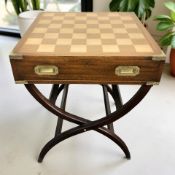 A campaign-style mahogany and brass mounted chess board table, width 60 cm.
