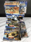 A group of Hasbro Star Wars models and figurines.