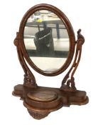 A Victorian mahogany oval dressing table mirror, height 66 cm.
