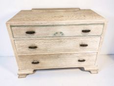 A 20th century limed oak three drawer chest, width 100 cm.