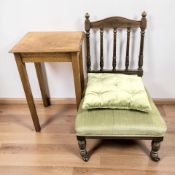 A late Victorian low salon occasional chair with cushion and an occasional table.