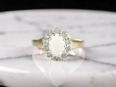 A 9ct gold opal and diamond cluster ring, size P CONDITION REPORT: 1.