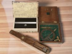 A metal lock box disguised as a book with keys, a hardwood pencil box,