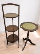 A mahogany three tier cake stand and a reproduction tripod table.