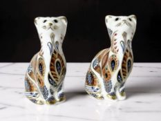Two Royal Crown Derby Siamese Kitten paperweights, with gold stoppers and original boxes.